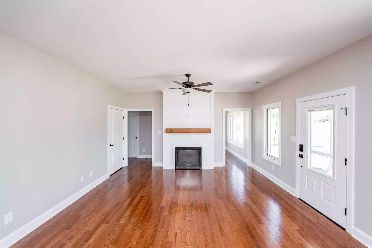 Open Living Space with Fireplace and Gleaming Hardwood Floors