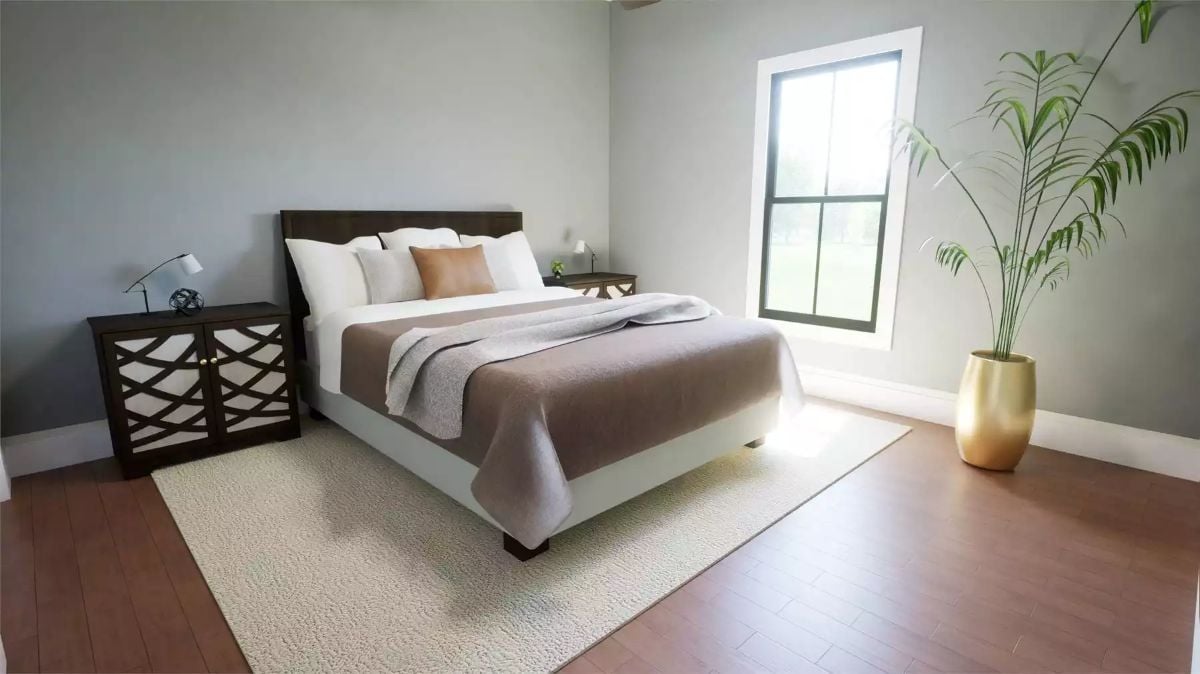 Serene Bedroom with Upholstered Platform Bed and Gold Planter Accent