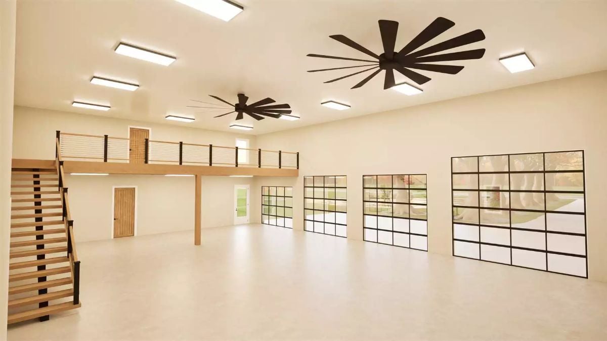 Loft Recreation Space with Multi-Blade Fans and Steel-Framed Windows