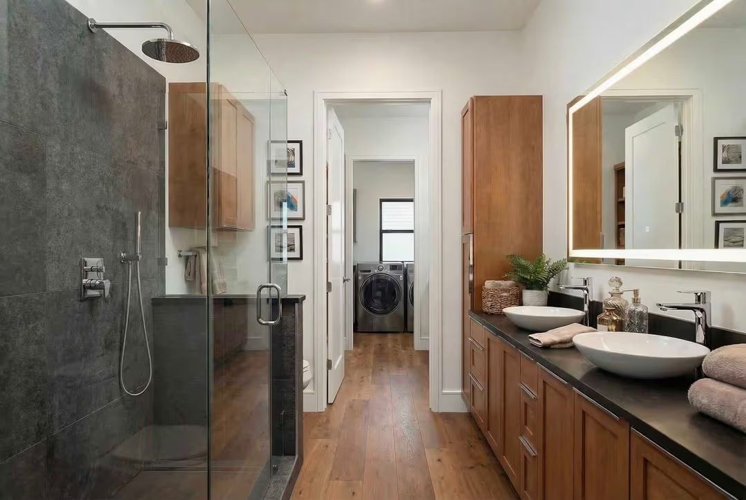 Double Vessel Sinks and Slate Tile Meet Warm Wood in a Spa-Inspired Bath