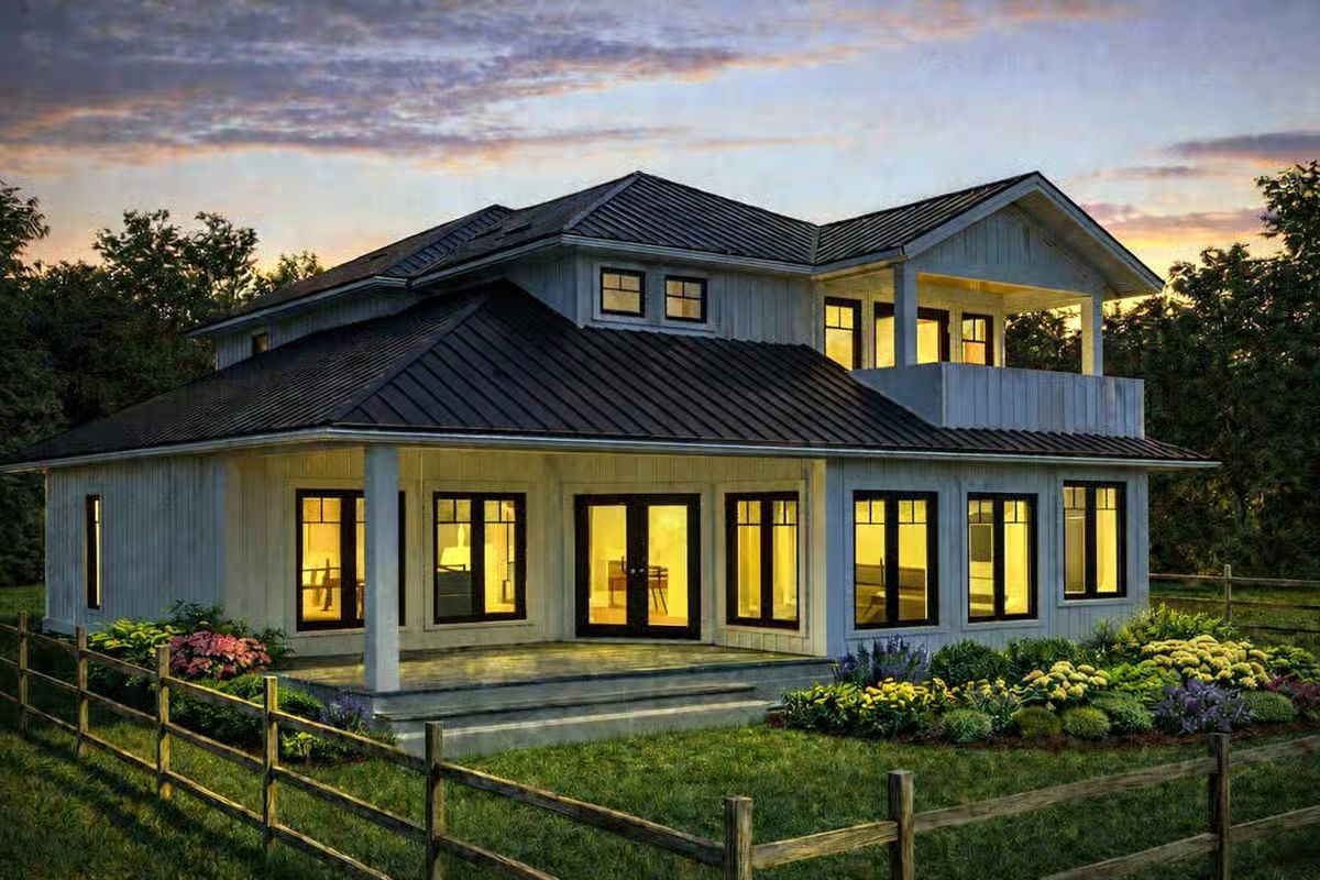 Warm Glow Illuminates Modern Farmhouse Exterior at Twilight