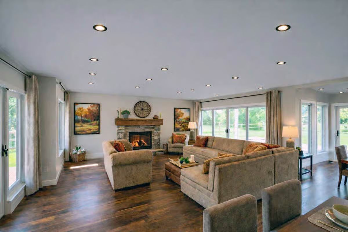 Recessed Lighting and Warm Neutrals Define Open Living Space