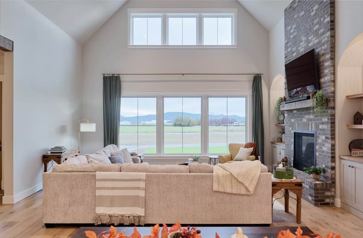 Vaulted Living Room with Mountain Views and Gray Brick Fireplace