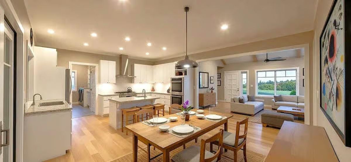 Expansive Open Concept Kitchen and Dining Area with Island Seating