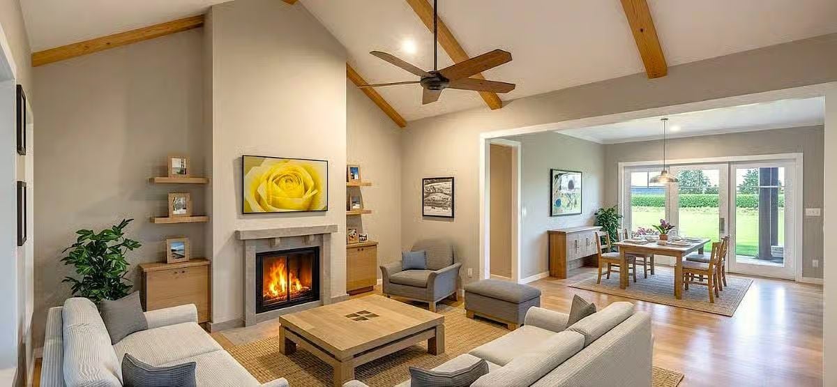 Vaulted Living Space Flows into Dining Room with Patio Access