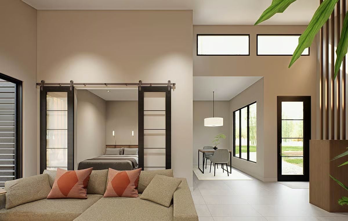 Barn Door Bedroom Entry Adds Industrial Edge to a Neutral Living Space