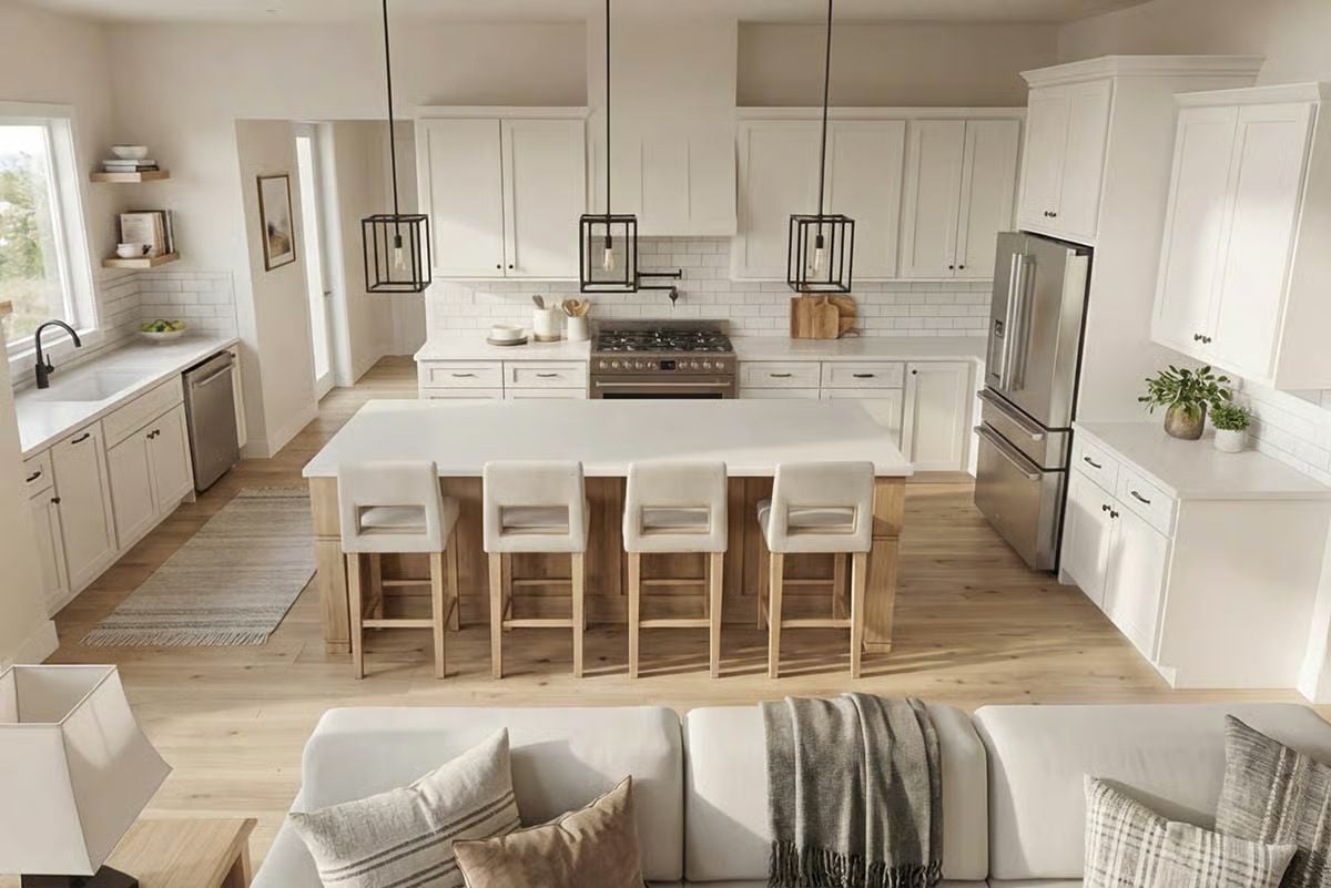 Warm Wood Tones and Cage Pendants Ground an Open-Concept Kitchen