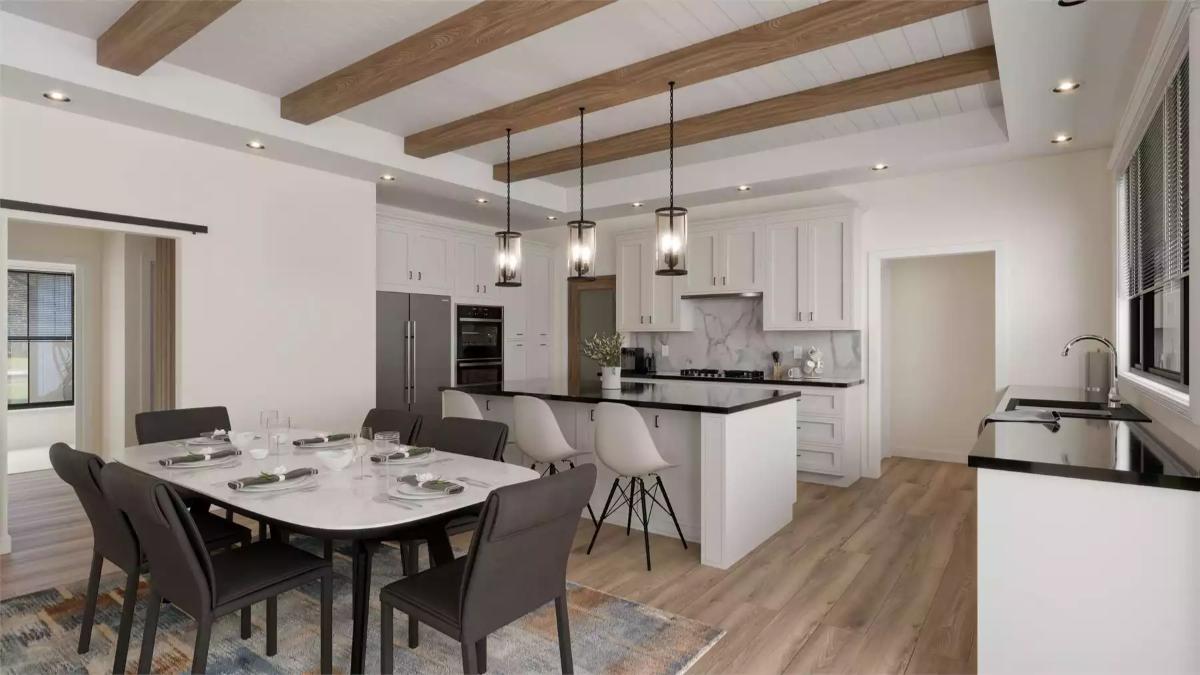 Exposed Ceiling Beams and Pendant Lights Anchor This Open Kitchen and Dining Space