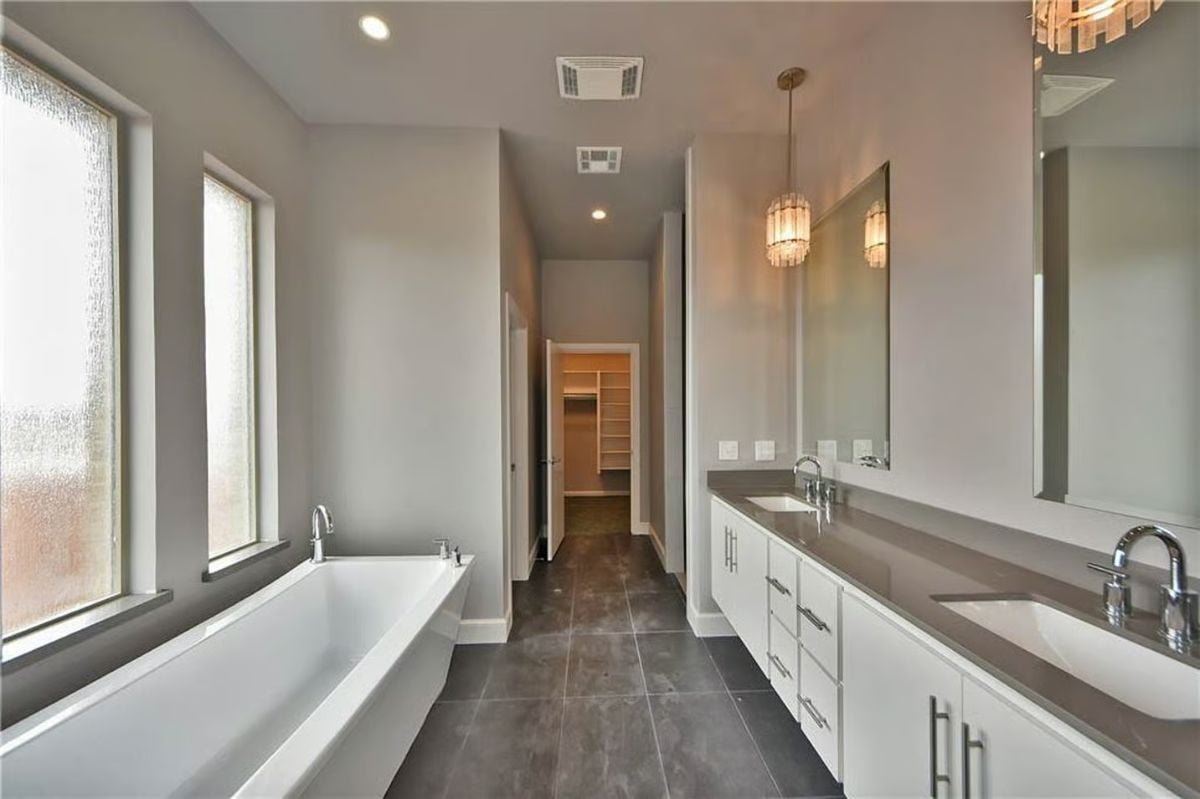 Freestanding Soaker Tub and Double Vanity Make This Primary Bath Feel Spacious