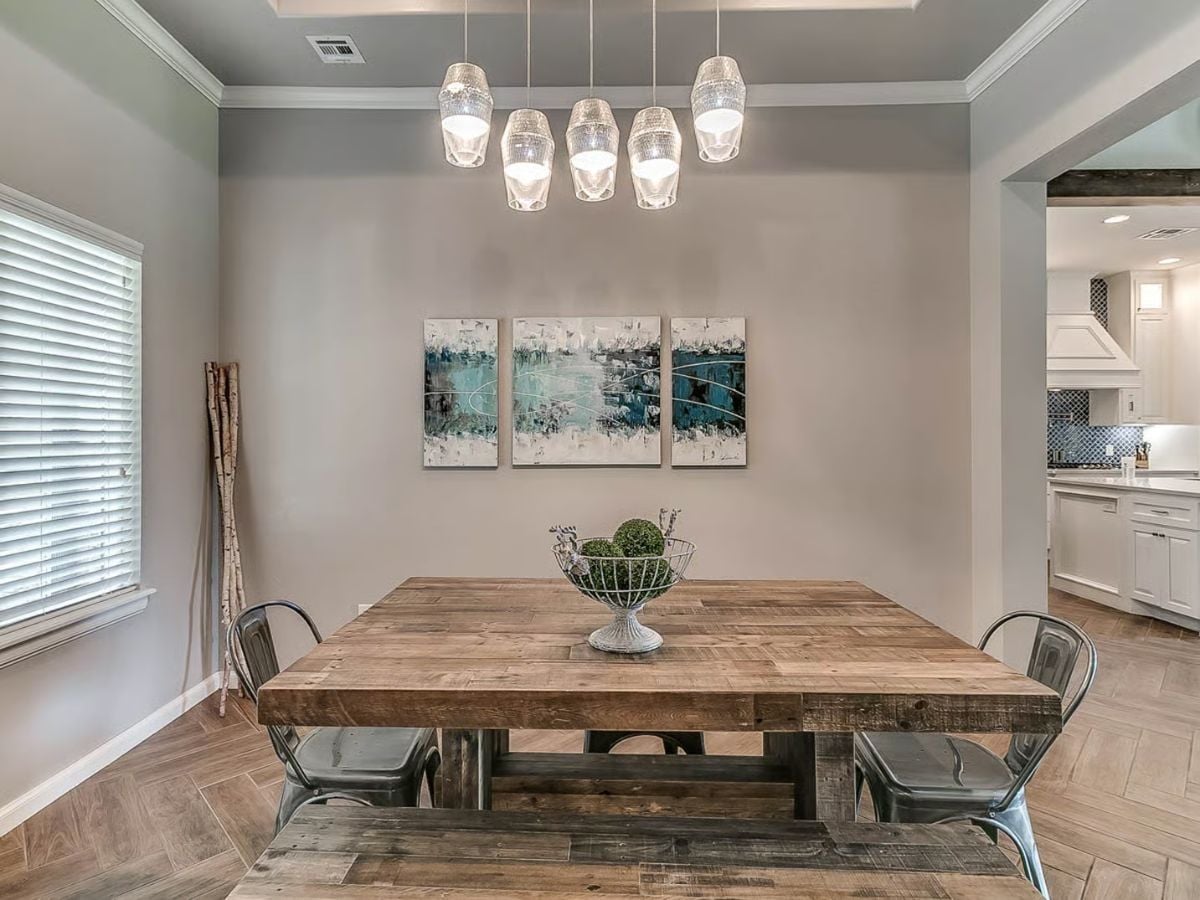 Dining Room with Rustic Wood Table and Modern Pendant Lighting