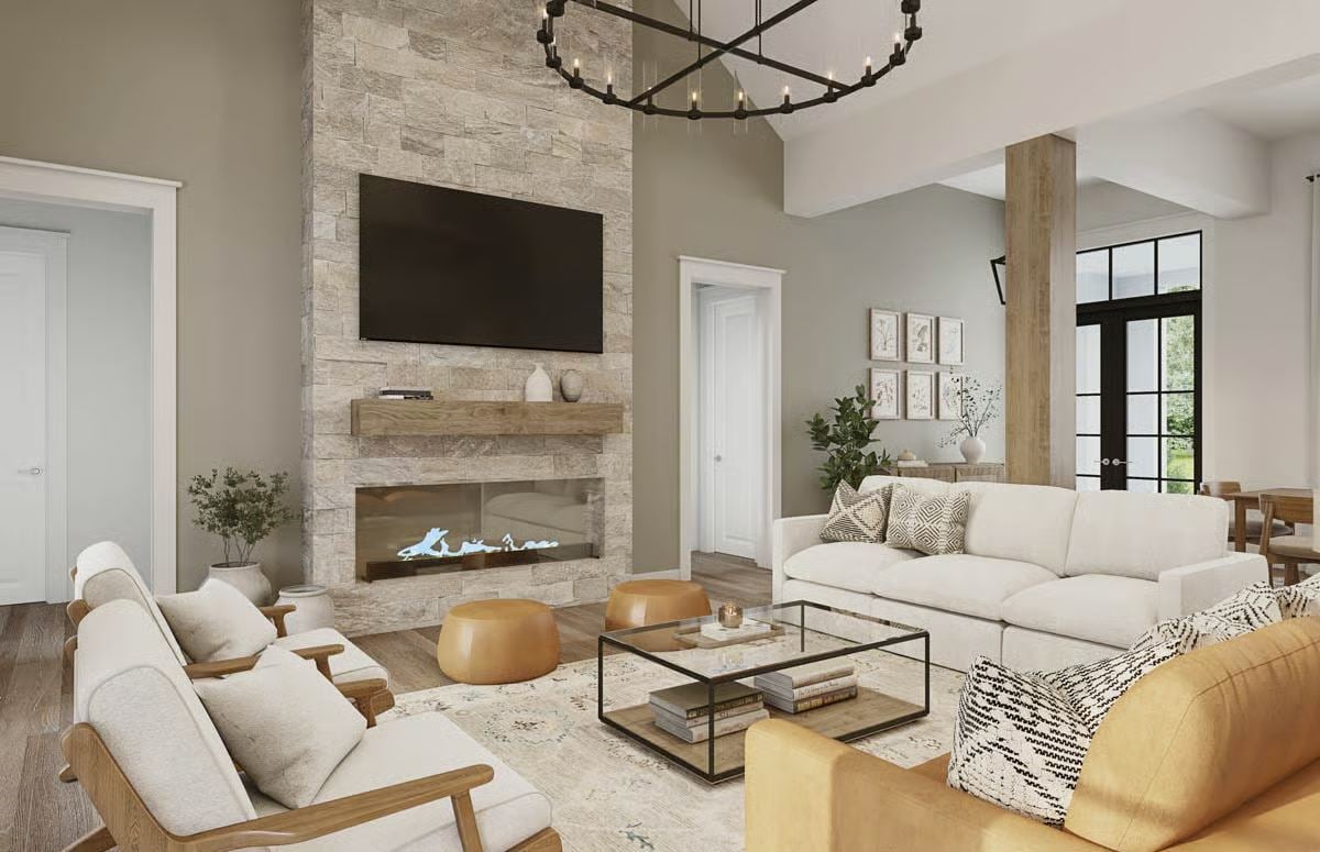 Vaulted Great Room with Stone Fireplace and Modern Farmhouse Furnishings