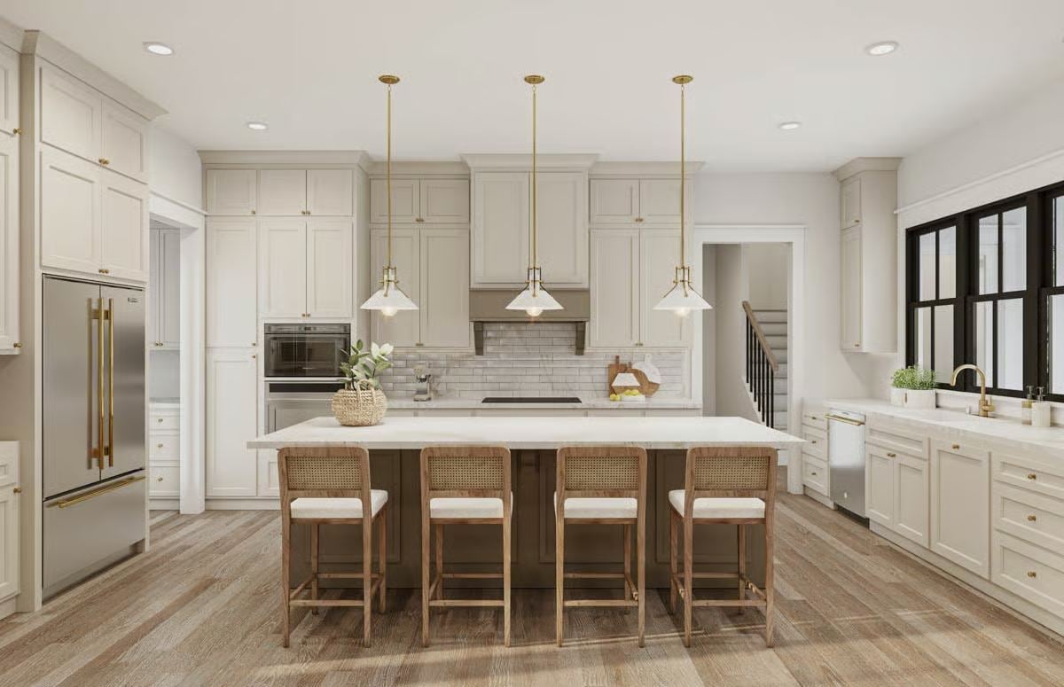 Bright Kitchen with White Cabinetry and Brass Pendant Lights