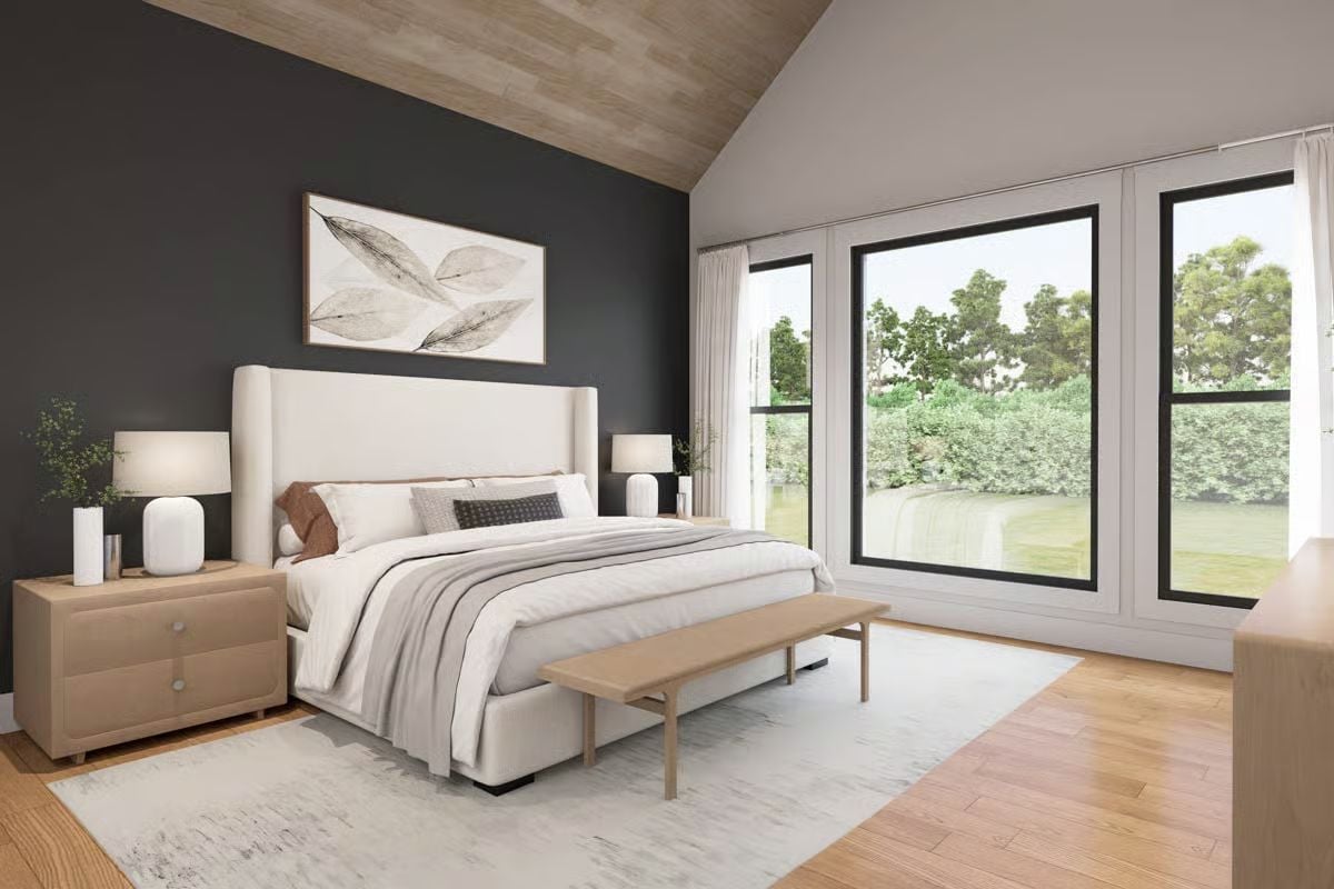Vaulted Wood Ceiling and Dark Accent Wall Define a Serene Primary Bedroom