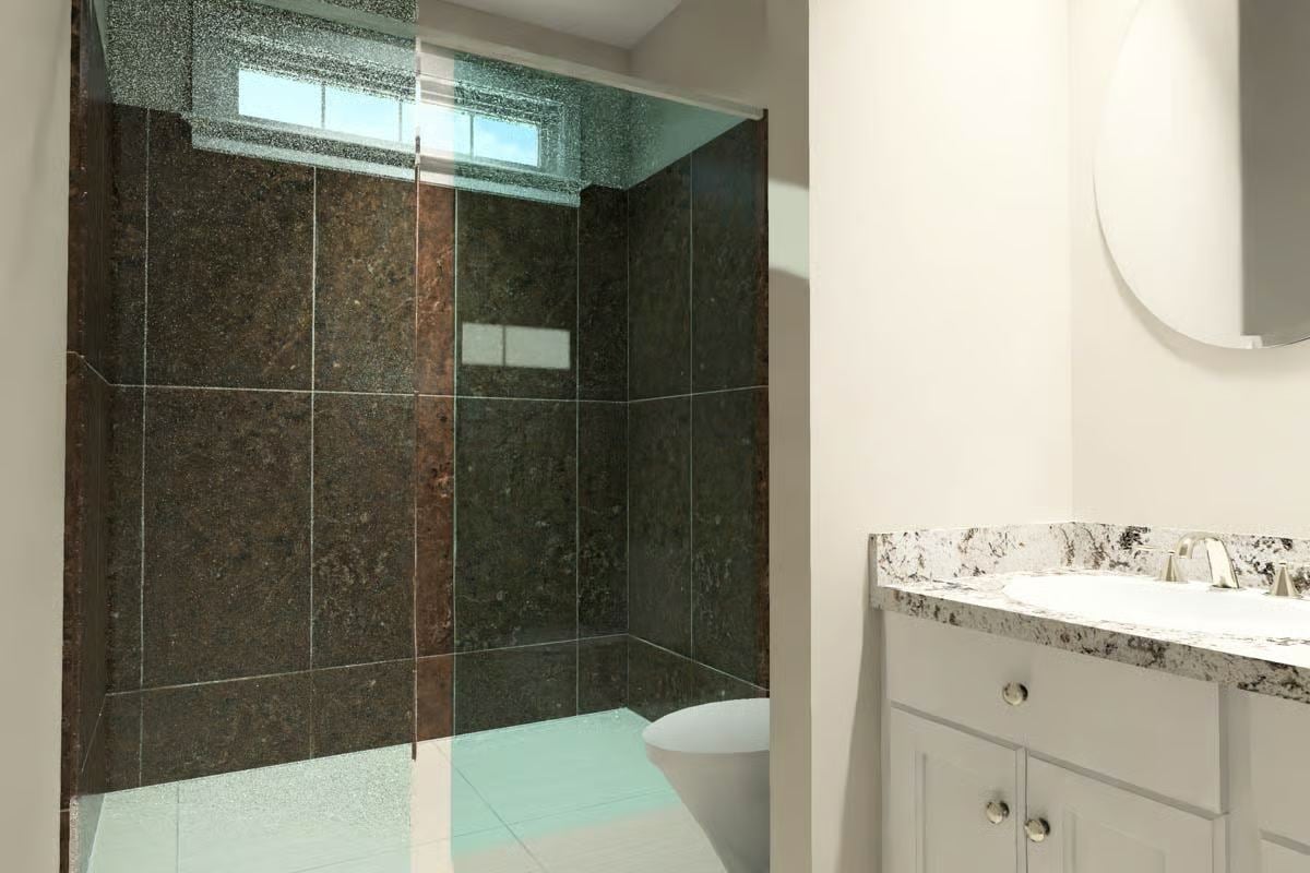 Spa-Inspired Bathroom with Dark Granite Tiles and Glass Shower