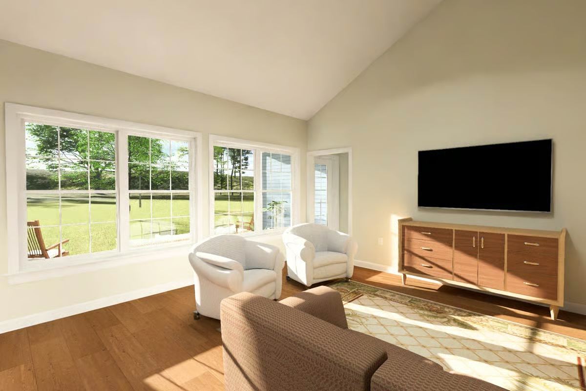 Vaulted Family Room with Bay Windows Overlooking Grassy Backyard