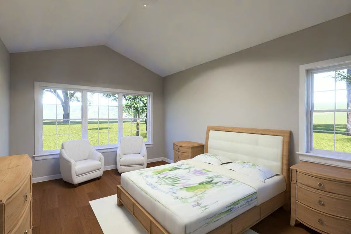 Vaulted Ceiling Bedroom with White Upholstered Bed and Oak Furniture