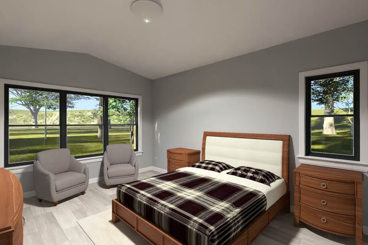 Bedroom with Plaid Bedding and Pastoral Views Through Black-Framed Windows