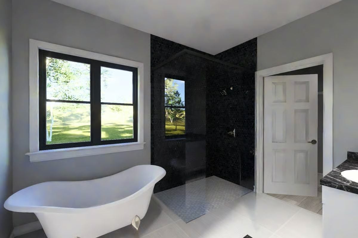 Spa Bathroom with Freestanding Tub and Black Marble Shower Enclosure