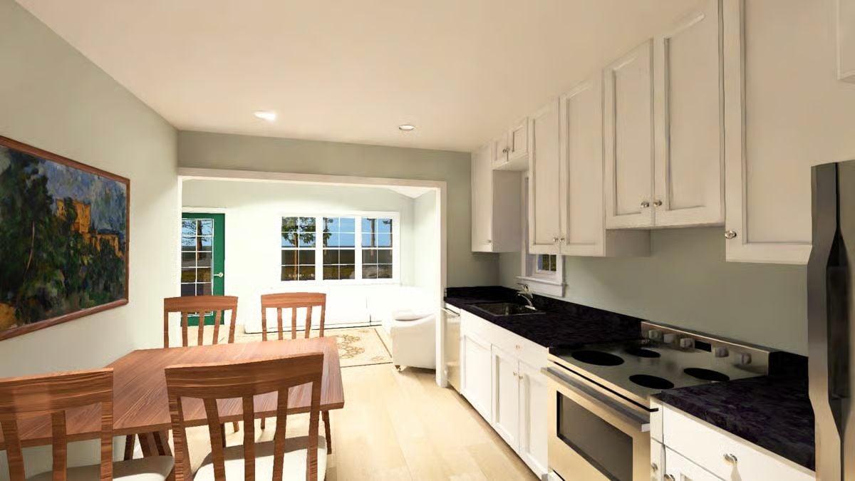 Black Granite Counters and White Cabinets in a Galley Kitchen