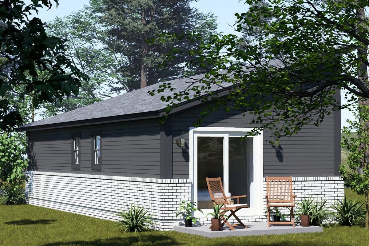 Dark Siding Meets White Brick on a Compact Backyard Retreat