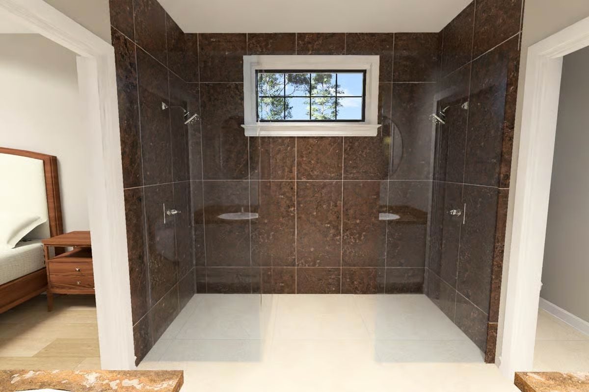 Double Shower Heads and Dark Stone Make This Bath Feel Like a Spa Retreat