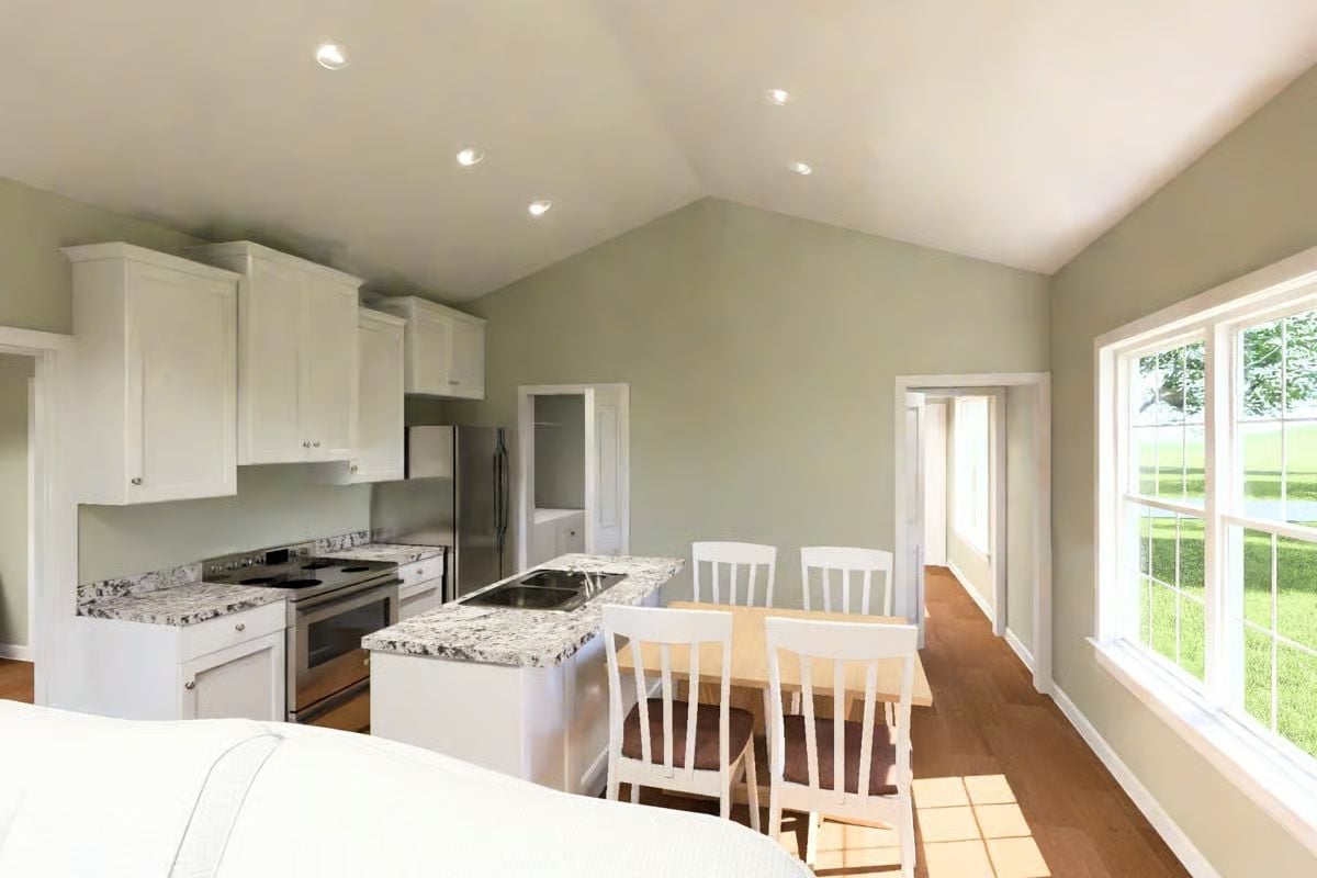 Vaulted Ceilings and Granite Counters Anchor an Open Kitchen-Dining Space