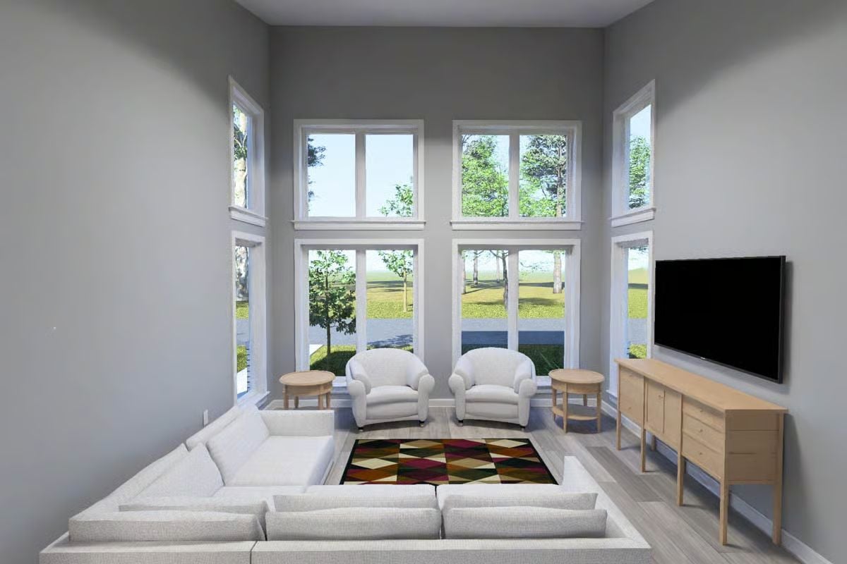 Floor-to-Ceiling Windows Flood This Living Room With Natural Light