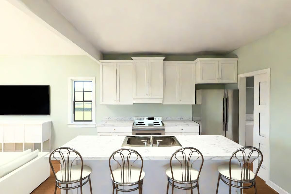 White Cabinets and Marble Counters Keep This Kitchen Grounded in Classic Style
