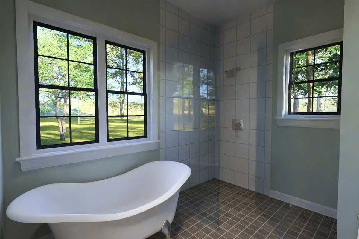 Clawfoot Tub Positioned Against Garden Windows Makes Bathing Feel Outdoor-Adjacent