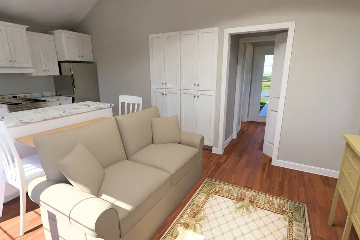 Built-In Storage and Hardwood Floors Ground This Compact Cottage Living Area