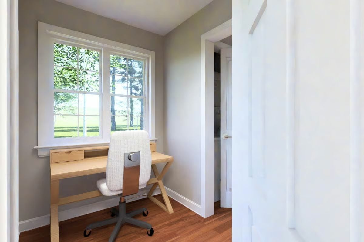Natural Wood Tones and Window Light Shape This Compact Home Office