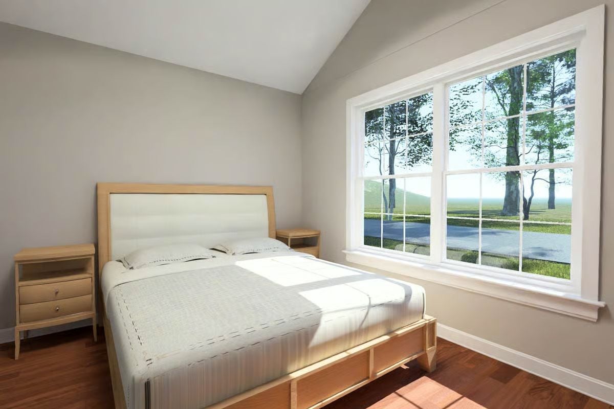 Sunlight and Wood Grain Carry the Bedroom's Quiet Warmth