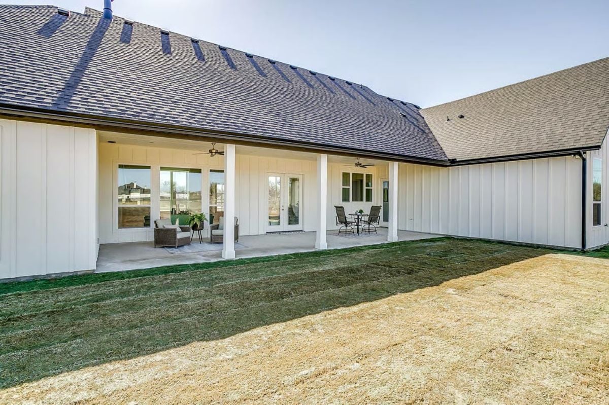 Covered Patio with Views Beyond Modern Farmhouse Exterior