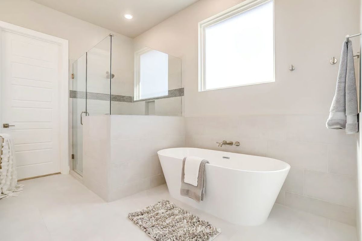 Primary Bathroom with Freestanding Tub and Glass-Enclosed Shower