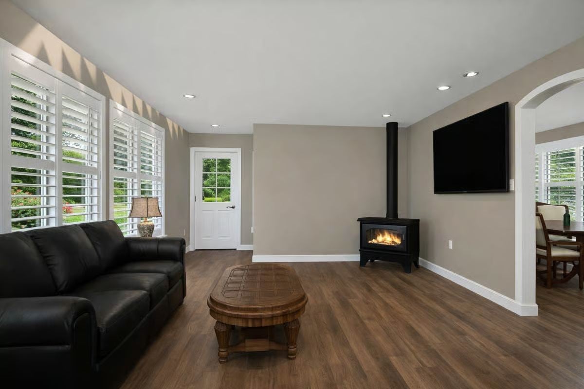 Family Room with Black Leather Sofa and Modern Gas Fireplace