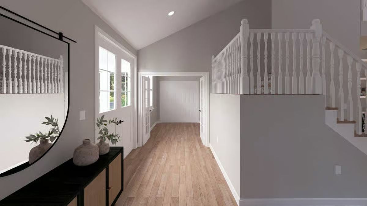 Vaulted Foyer Entry Opens to Staircase and Hallway Beyond