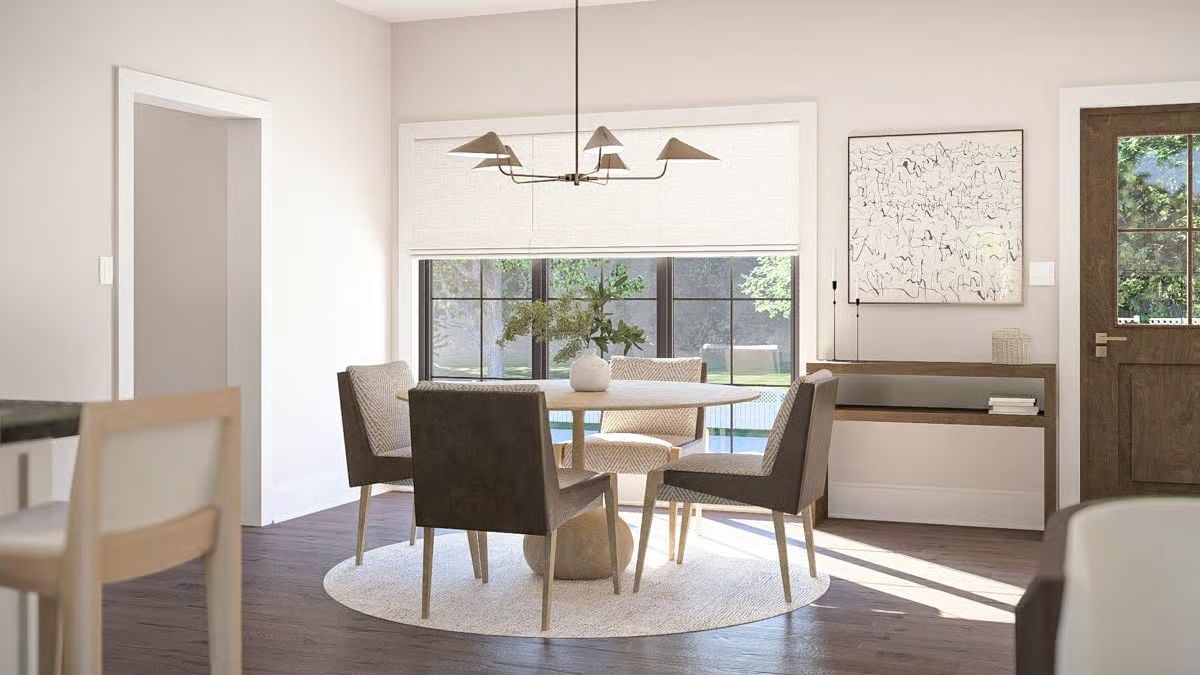Neutral Dining Room with Round Wood Table and Modern Chandelier