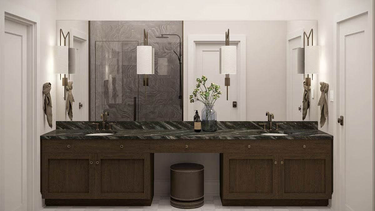 Double Vanity Bathroom with Dark Marble Countertop and Wood Cabinetry
