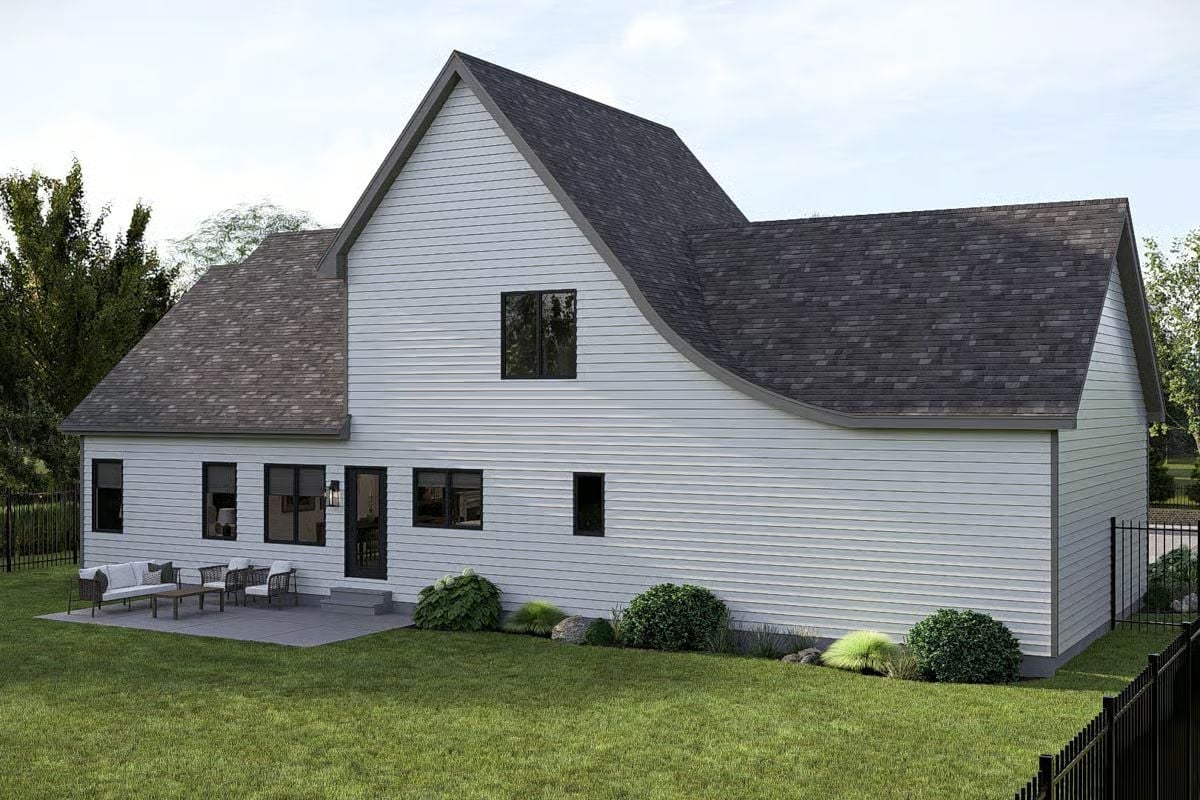 White Siding and Dark Shingle Roof Frame a Modern Farmhouse Exterior