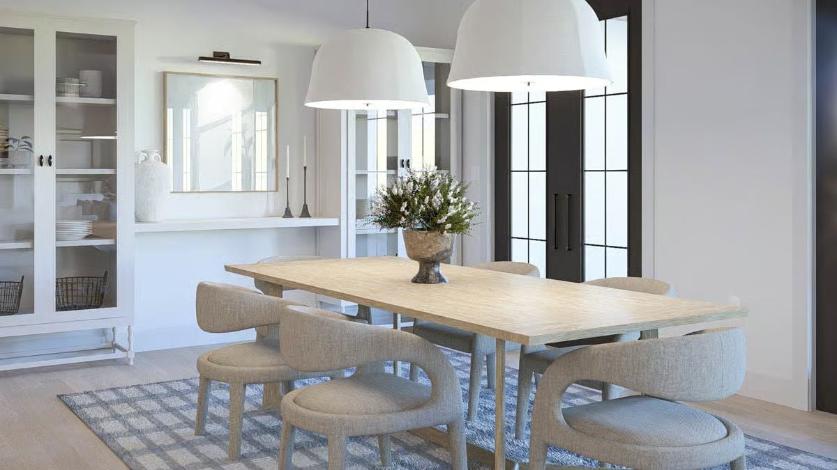 Open Dining Room with Linen Chairs and Oversized White Pendant Lights
