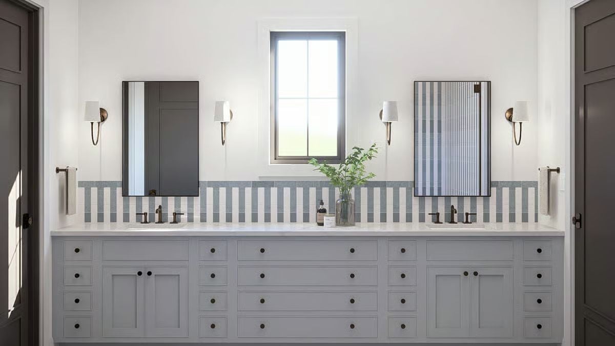 Dual Vanity Bathroom with Vertical Striped Tile and Framed Mirrors