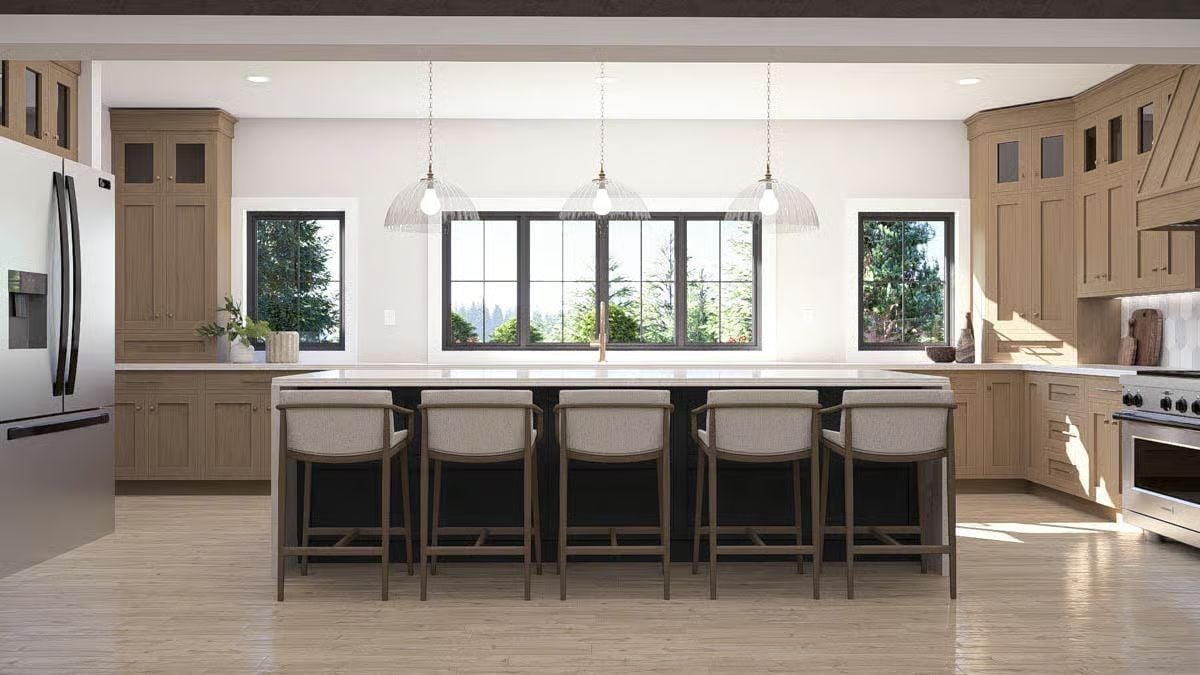 Pendant Lights and White Quartz Draw the Eye Across a Long Kitchen Island