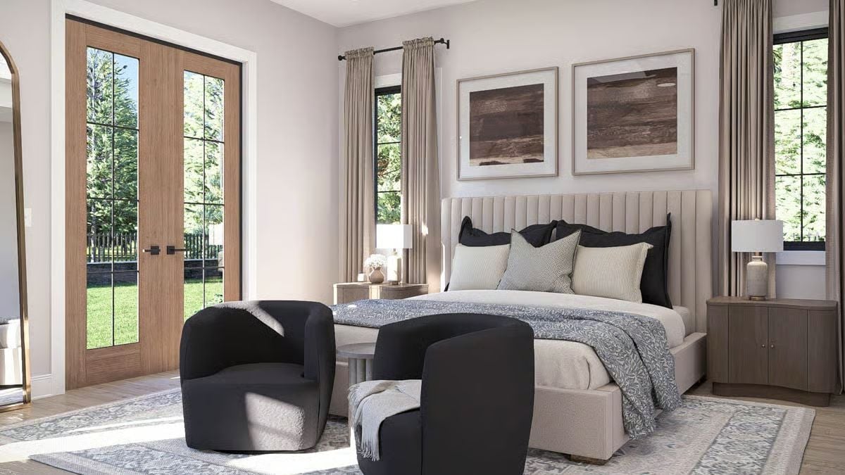 Channeled Headboard and Black Accent Chairs Ground a Neutral Primary Bedroom