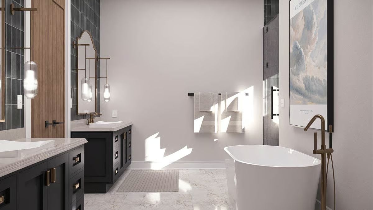 Brass Fixtures and Freestanding Soaking Tub Anchor a Spa-Like Primary Bath