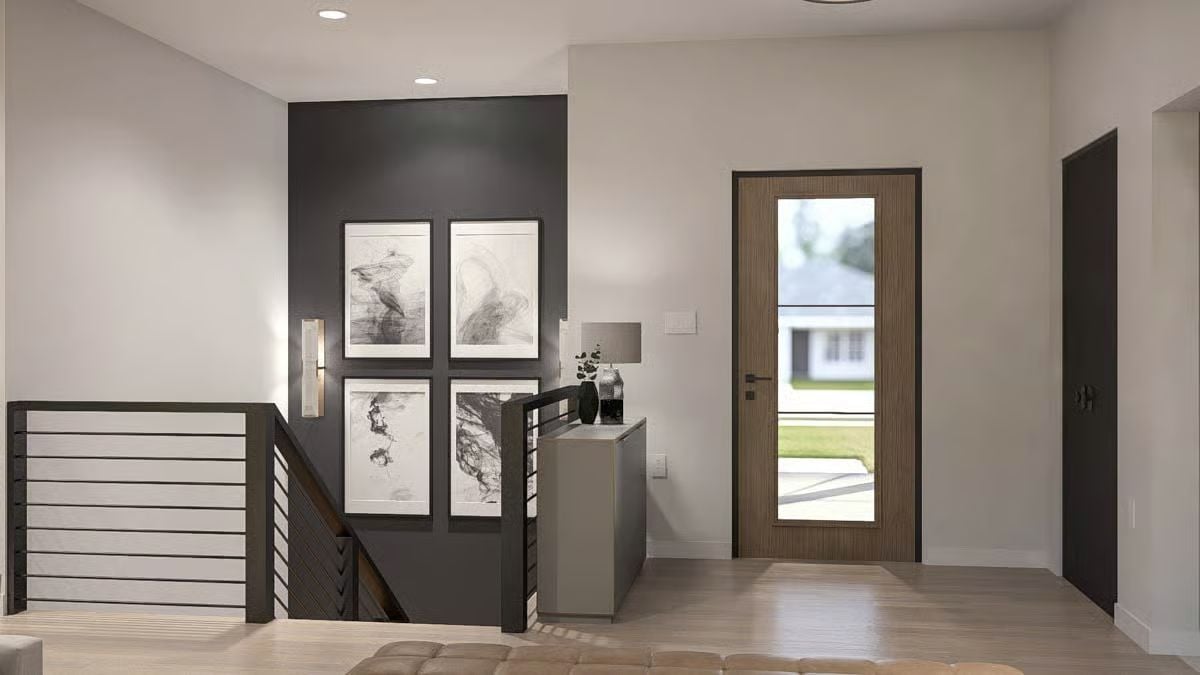 Dark Accent Wall and Gallery Frames Define This Foyer's Character