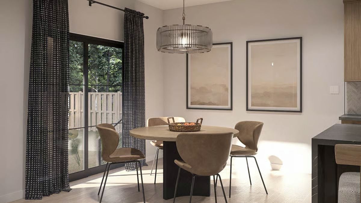 Round Table and Glass Pendant Pull This Dining Room Together