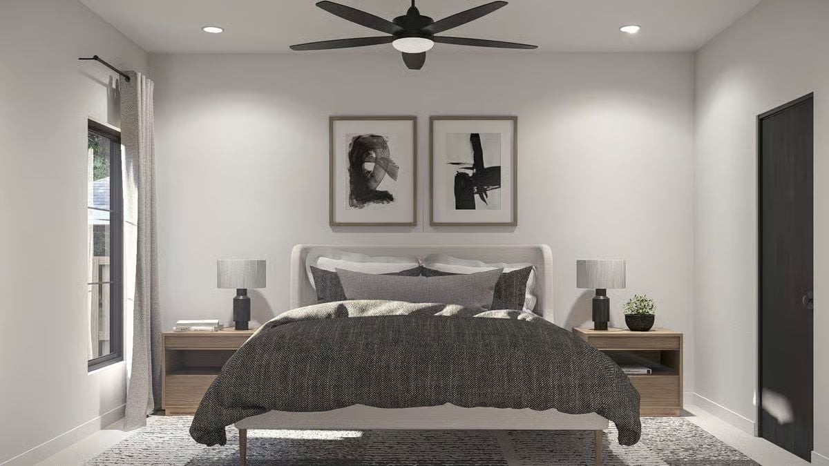 Black Ceiling Fan and Abstract Art Set the Tone in This Primary Bedroom