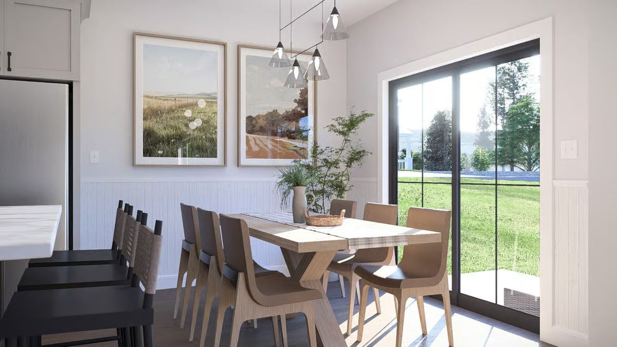 Pendant Cluster Lighting and Sliding Glass Doors Define This Dining Space