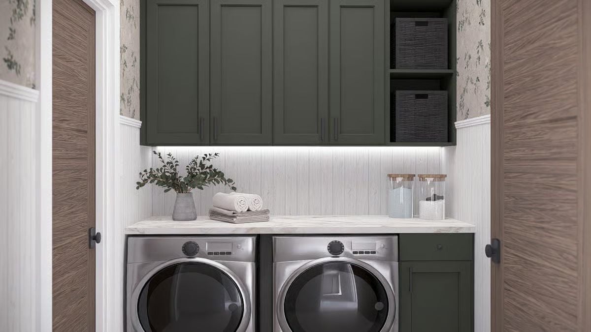 Forest Green Cabinetry and Under-Cabinet Lighting Define This Laundry Room