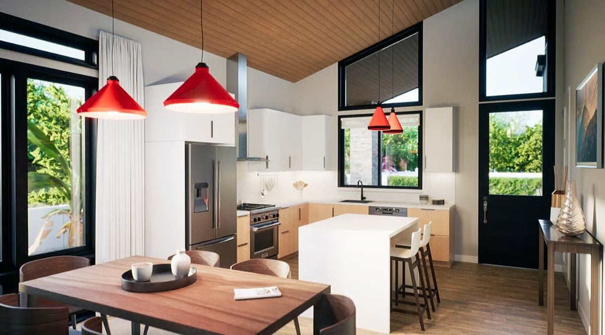 Red Pendants and Warm Wood Tones Anchor an Open-Plan Kitchen